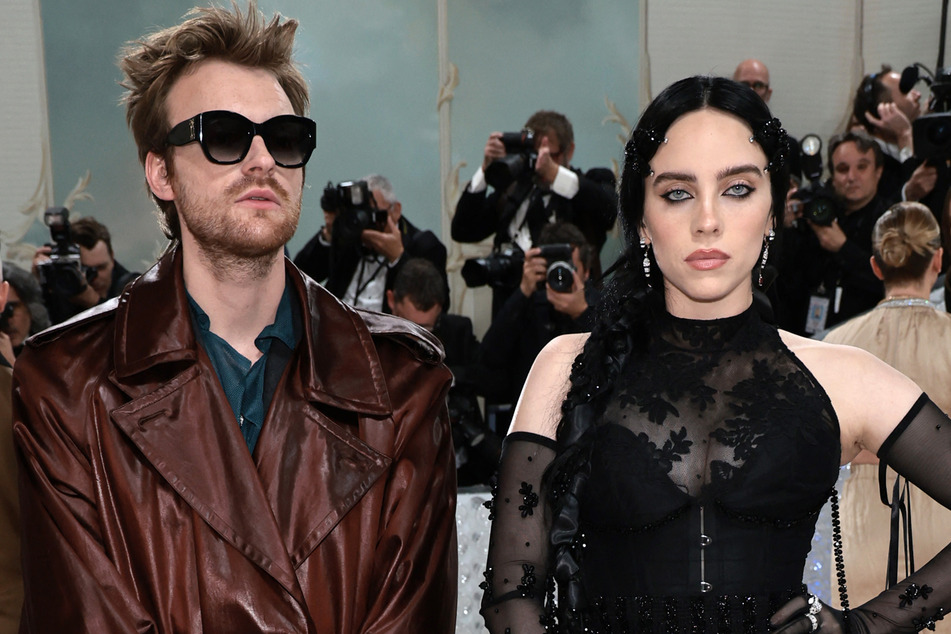 Billie Eilish (r) has been granted a restraining order against a man who sent "disturbing" messages and threatened her brother, Finneas.