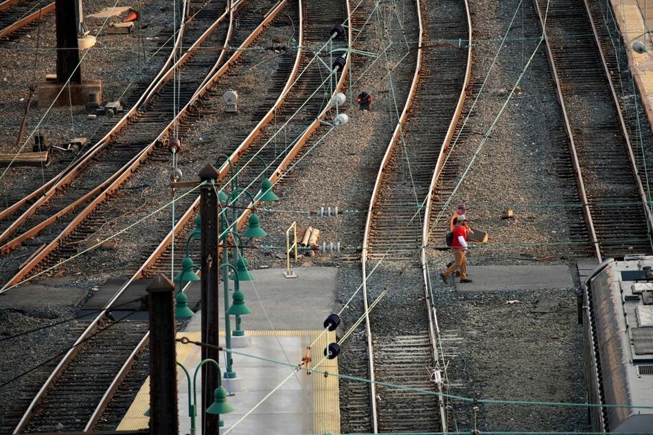 Railway workers walk through Union Station in Washington DC.