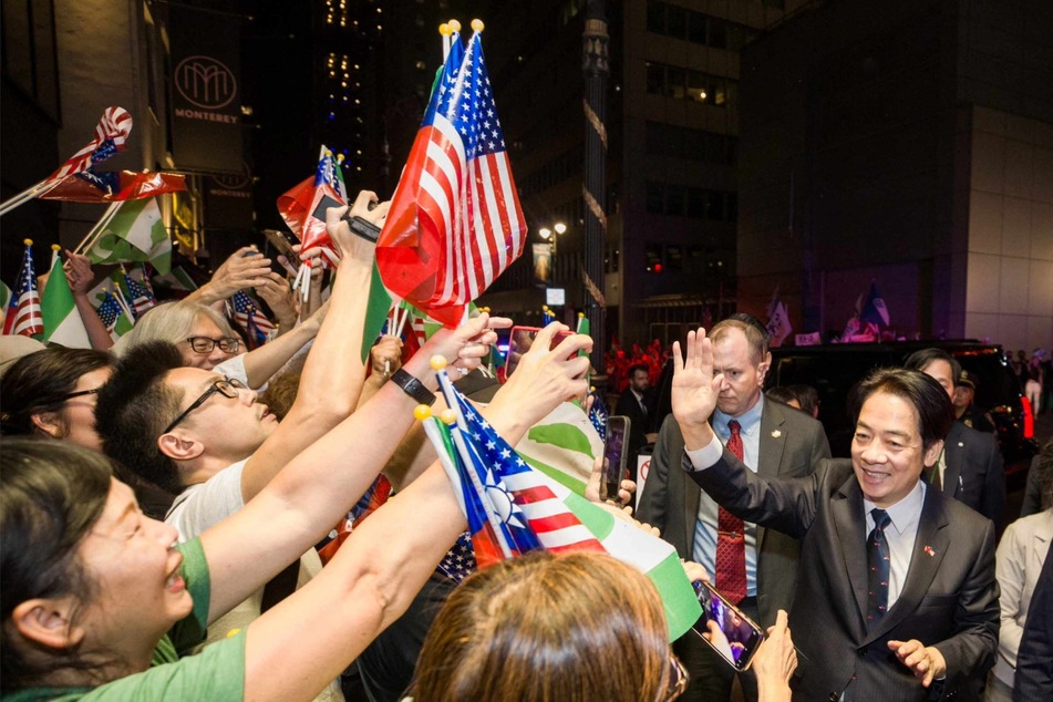 China vows "forceful" response as Taiwan VP lands in NYC