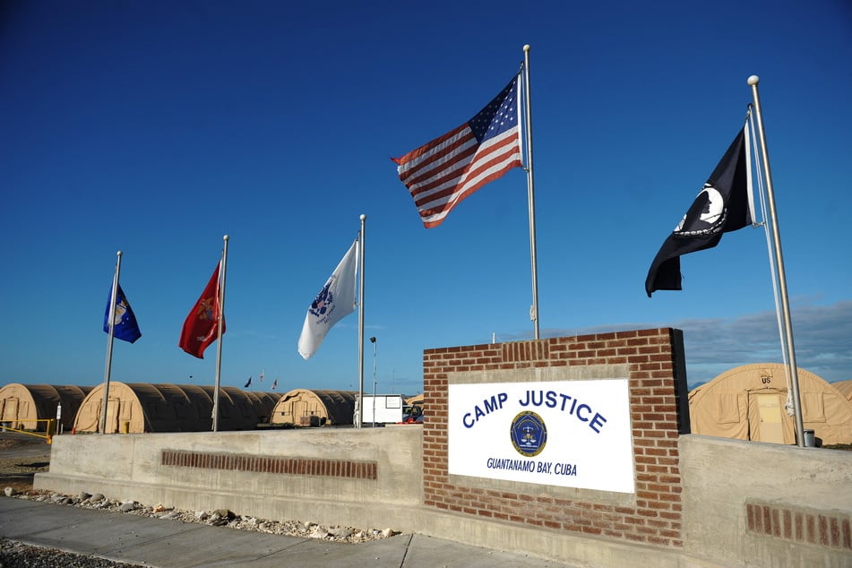 The picture shows a "Camp Justice" sign near the high-tech, high-security courtroom at Guantanamo Bay, Cuba.