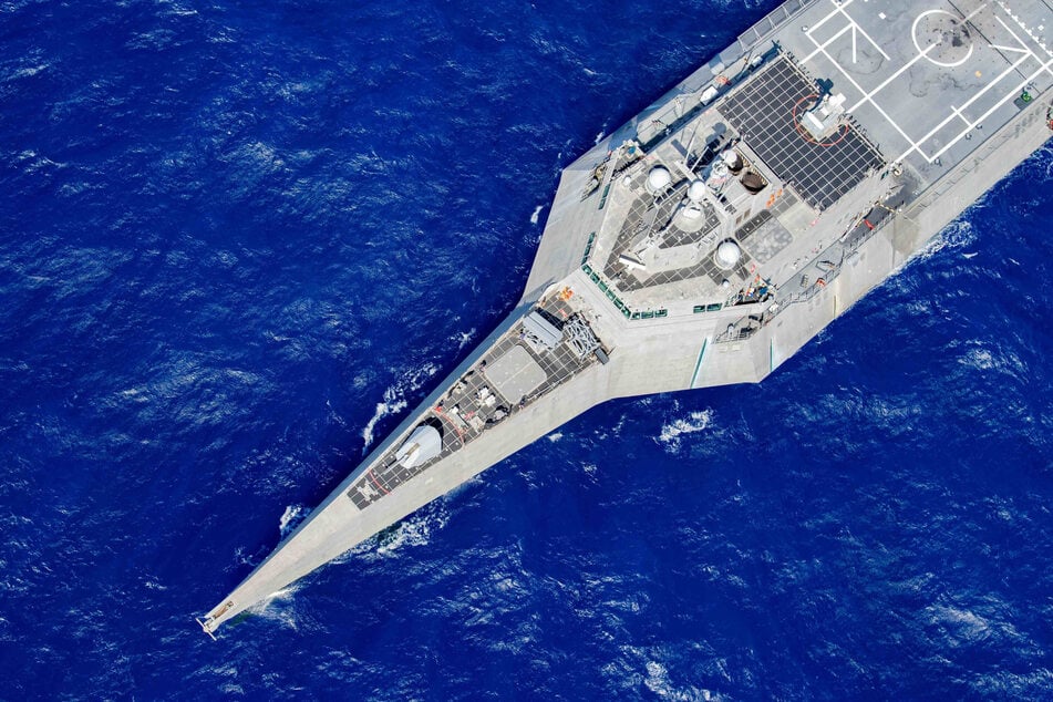 The USS Charleston is pictured during operations with Destroyer Squadron Seven in the Philippine Sea on October 4, 2021. China said on Tuesday that it sent forces to "track and monitor" the vessel as it sailed through disputed waters in the South China Sea.