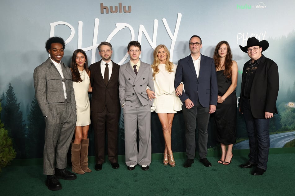 From l. to r.: Maliq Johnson, Mahaela Park, Nick Paley, Sam Nivola, Connie Britton, Anthony King, Grace Brennan, and Colter Lee attend the Los Angeles premiere of Hulu's Phony on October 13, 2026.