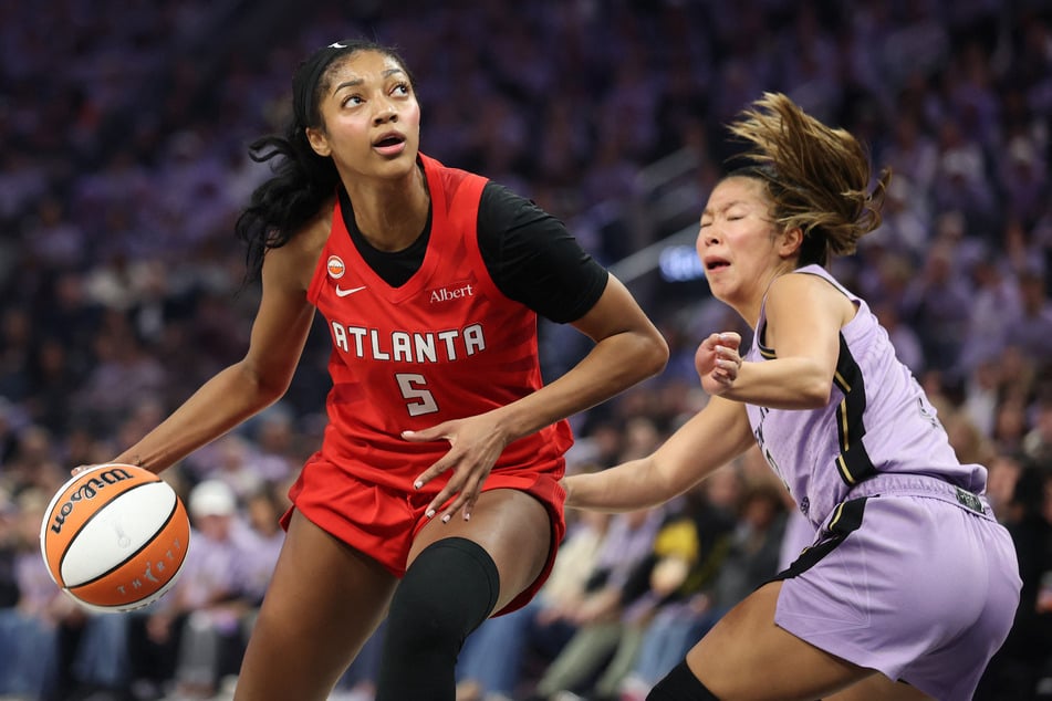 Angel Reese of the Atlanta Dream (l.) dribbles against Kaitlyn Chen of the Golden State Valkyries (r.) during the second quarter in game two of the WNBA Finals at Chase Center on October 19, 2026.