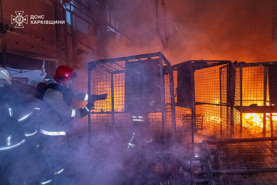 Firefighters work at a terminal of a private postal company, the site of a Russian drone strike, in Odesa, Ukraine, on June 3, 2025.