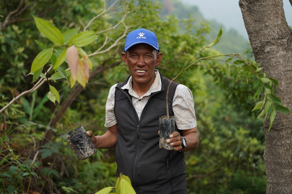 Pasang Dawa Sherpa, a 26-time Everest climber, plants a tree to spread awareness on World Environment Day, in Kathmandu, Nepal.