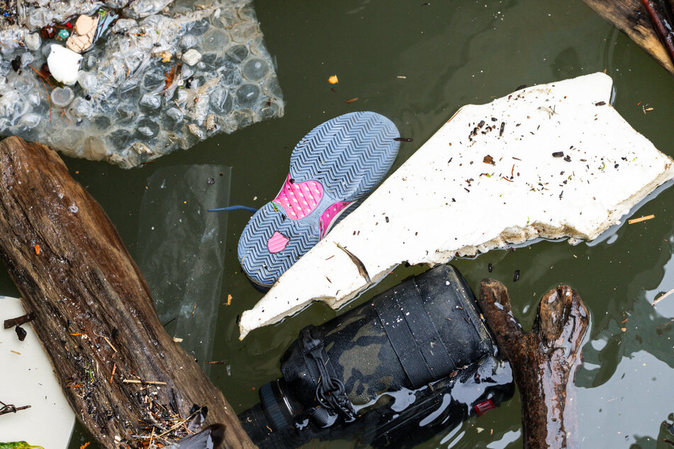 A shoe is seen floating near where a helicopter crashed on the Hudson River on Friday in Jersey City, New Jersey.