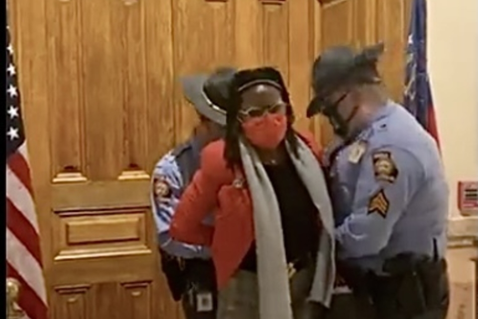 Representative Cannon was led out of the Georgia Capitol building in handcuffs.