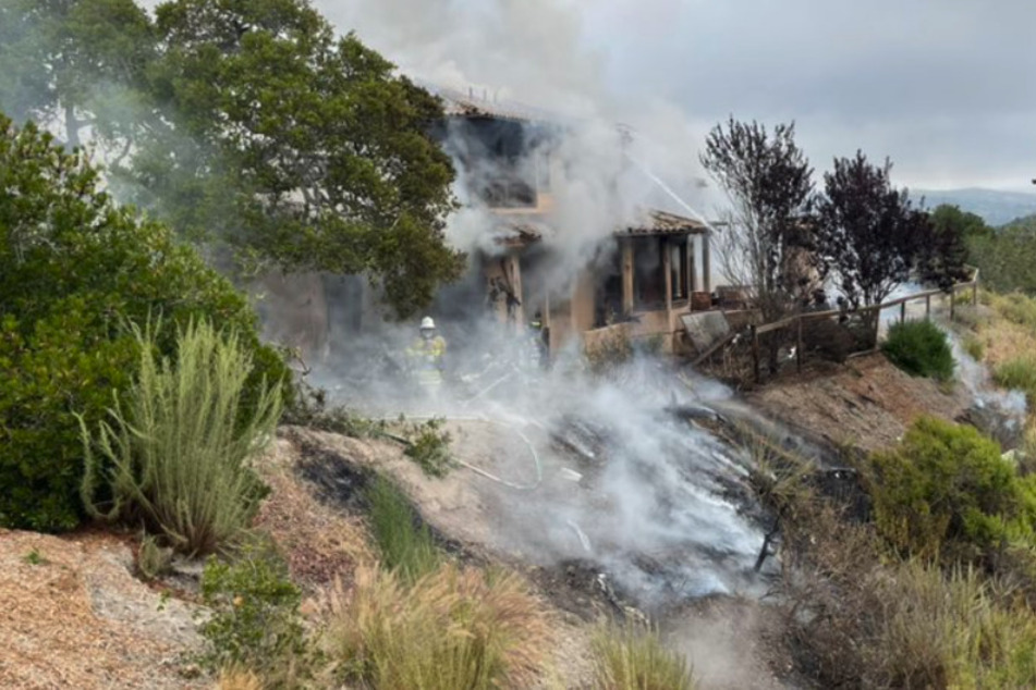 Plane crashes into California hillside home, killing everyone on board