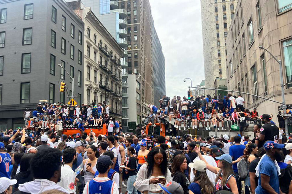 Knicks fans scrambled to get viewing spots from above, blocks away from the parade route.
