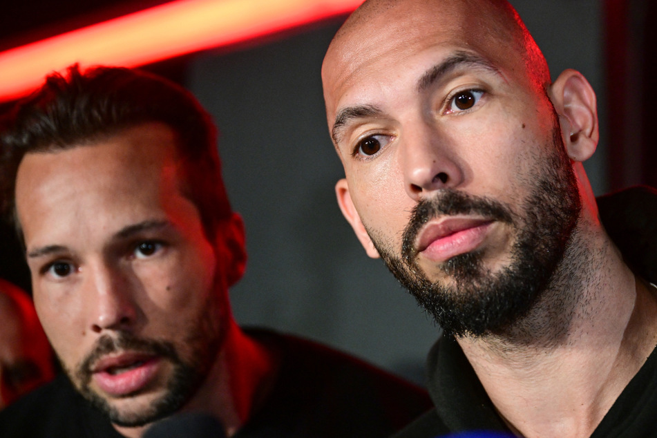 Avowed misogynist and social media influencer Andrew Tate (r.) and his brother have been charged with several counts of rape, assault and trafficking.