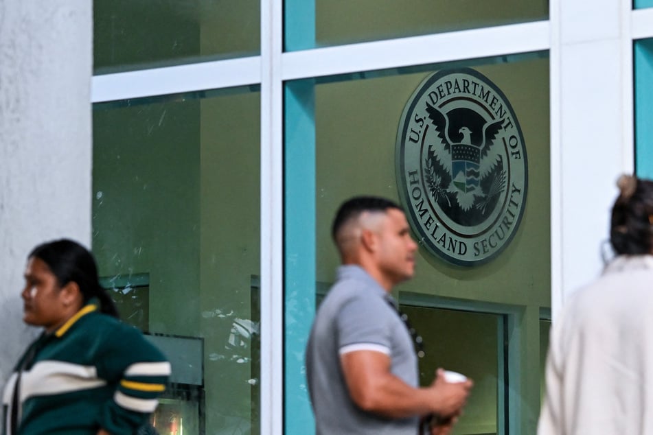 People wait in line outside the Miami Immigration Court in Florida on September 3. In Trump's second term, unaccompanied migrant minors are increasingly facing immigration court without legal assistance.