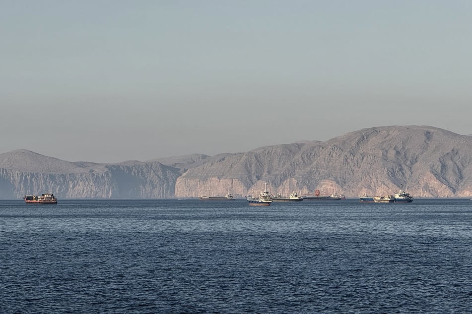 Vessels are seen anchored in the Strait of Hormuz, off the port city of Khasab on Oman’s northern Musandam Peninsula on May 17, 2026.