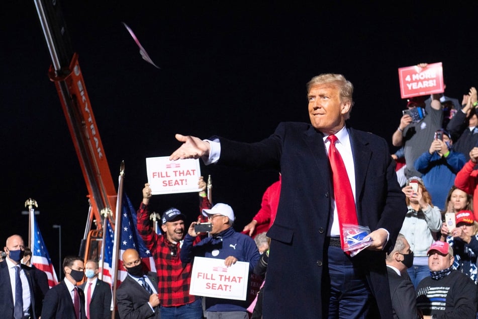 Eli Bartov, an expert witness for Donald Trump (pictured) in his New York fraud trial, has been paid nearly $900,000 to defend the former president in court.