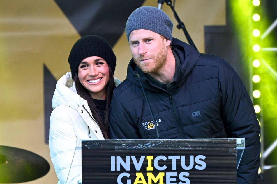 Prince Harry (r) and Meghan Markle reportedly blame the king's letter for Uganda's recent decision to snub the Duke's Invictus Games. The next competition will be held in the UK in July.