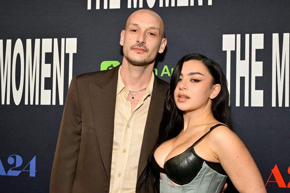 Charli xcx (l) got married last summer. The singer says she and her hubby aren't that traditional when it comes to marriage.