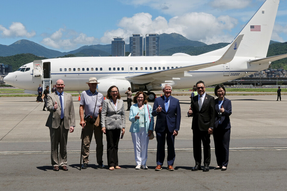 Senator Roger Wicker, Senator Deb Fischer, and others pose for pictures upon arriving at the Songshan Airport in Taipei, Taiwan, on August 29, 2025.