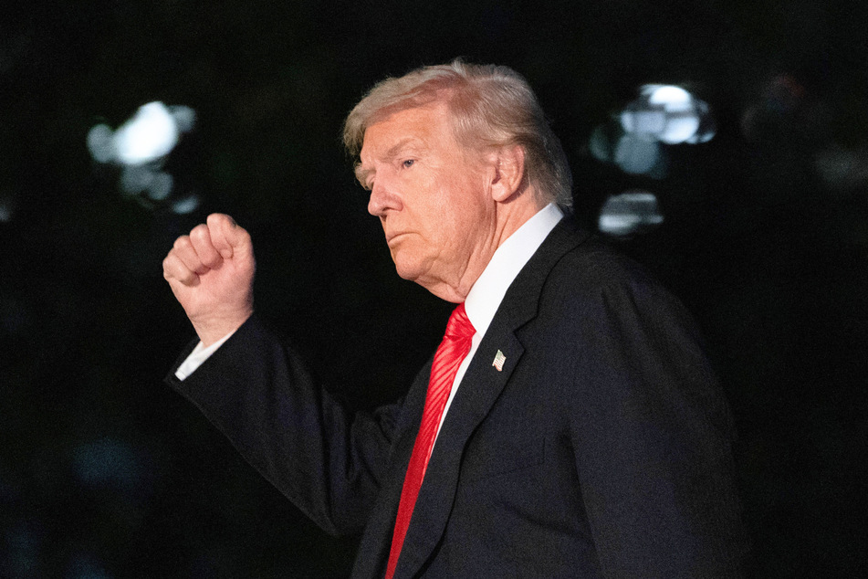 President Donald Trump gestures as he walks on the South Lawn upon arrival at the White House in Washington DC on November 2, 2025.