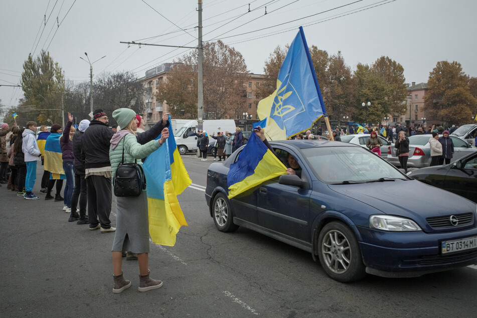Local residents celebrated on Friday after Russia's retreat from Kherson.