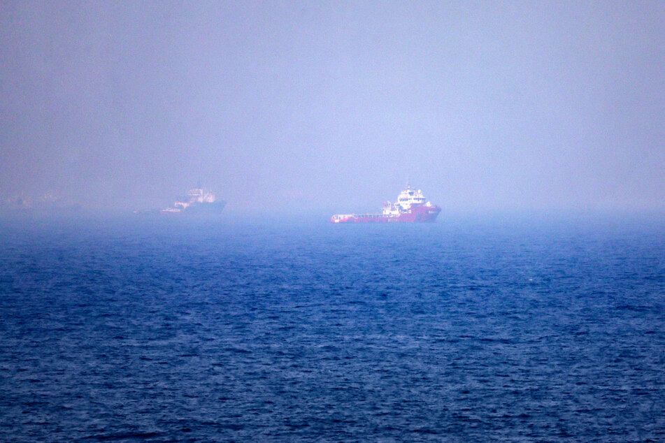 This picture shows ships sailing near the Strait of Hormuz off the eastern coast of the United Arab Emirates at Khor Fakkan on July 13, 2026.