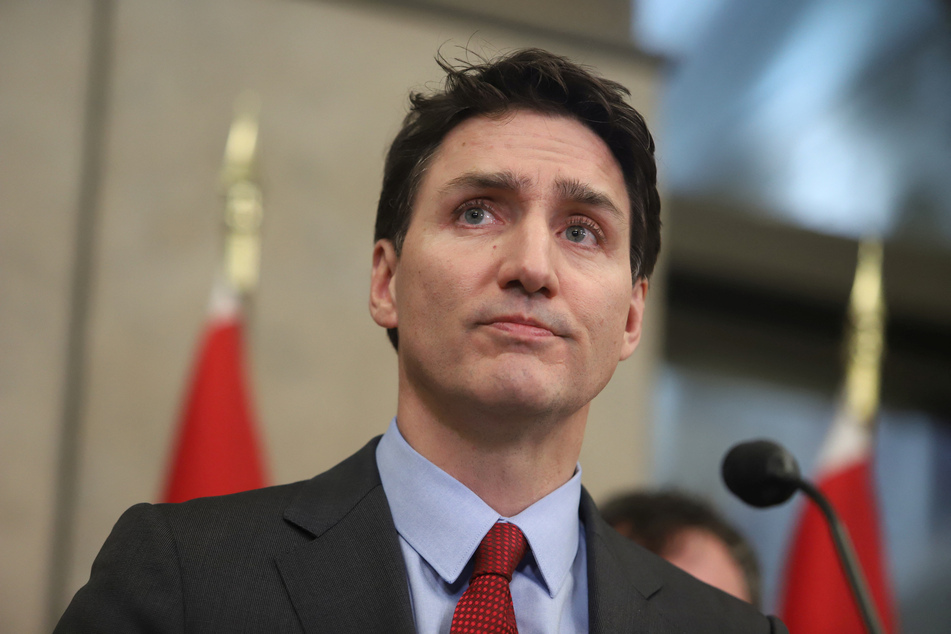 Canada's Prime Minister Justin Trudeau participates in a press conference responding to US President Donald Trump's orders to impose 25% tariffs on Canadian imports.
