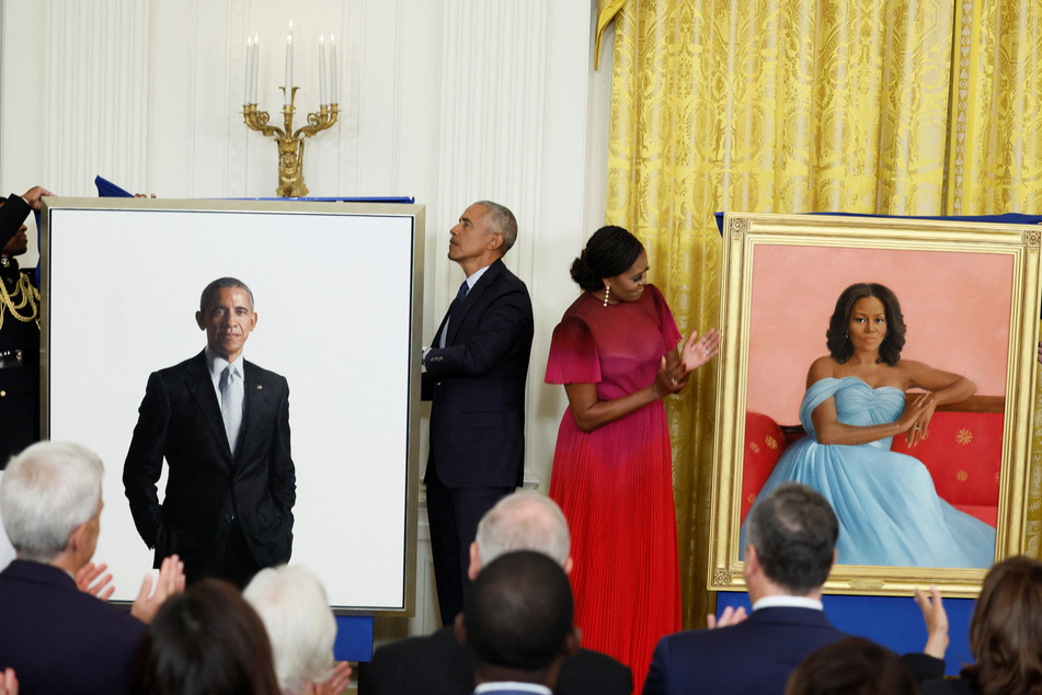 Former President Barack Obama and First Lady Michelle Obama attend the unveiling of their official White House portraits.