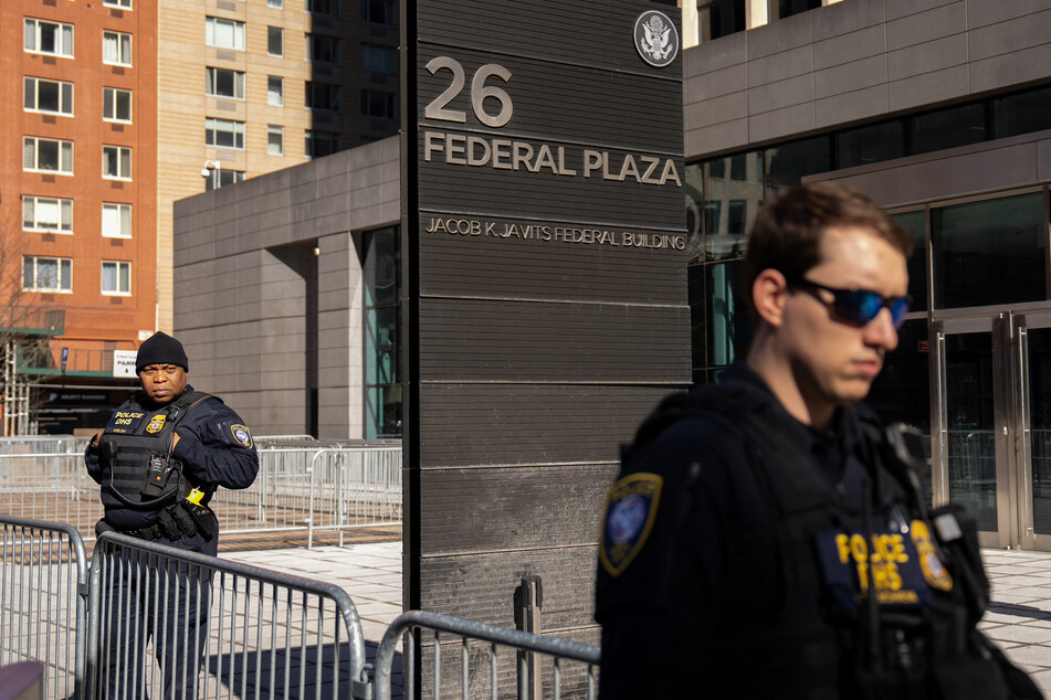 Department of Homeland Security officers stand guard at 26 Federal Plaza in New York City.