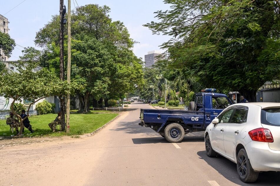 The Congolese Republican Guard and police block a road around the scene of an attempted Coup in Kinshasa.