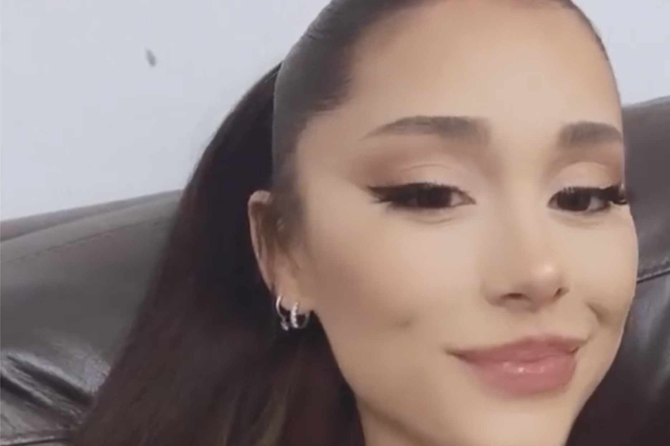 Ariana Grande might be taking a page out of Taylor Swift's playbook by hinting at either an album or single title via her wardrobe!