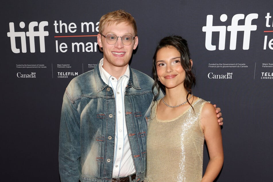 Obsession director Curry Barker (l) and star Inde Navarrette reunited to celebrate the movie's breakout success. The horror flick first premiered at last year's TIFF.