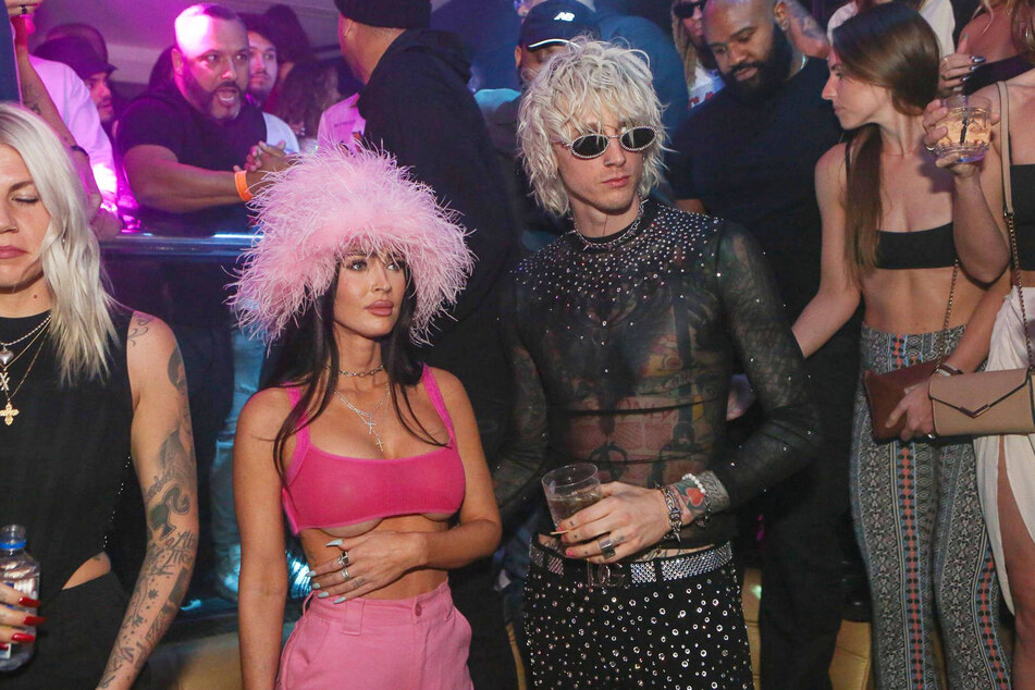 Machine Gun Kelly reveals he went to rehab for Megan Fox (r.) and their daughter on his song, Treading Water.