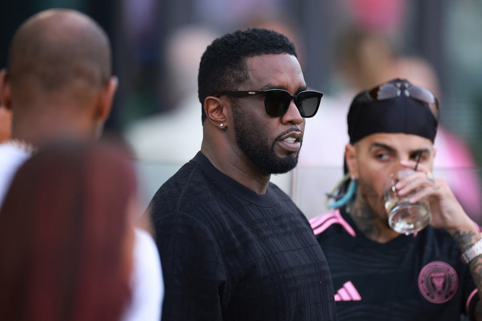 Sean "Diddy" Combs' (c.) latest accuser alleged that he was humiliated in front of A-list guests during a party for the jailed mogul's son Christian Combs.