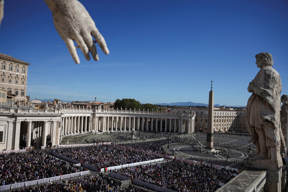 People gather to attend a mass led by Cardinal Luis Antonio Tagle, including special prayers for the health of Pope Leo, in St. Peter's Square at the Vatican on October 14, 2026.