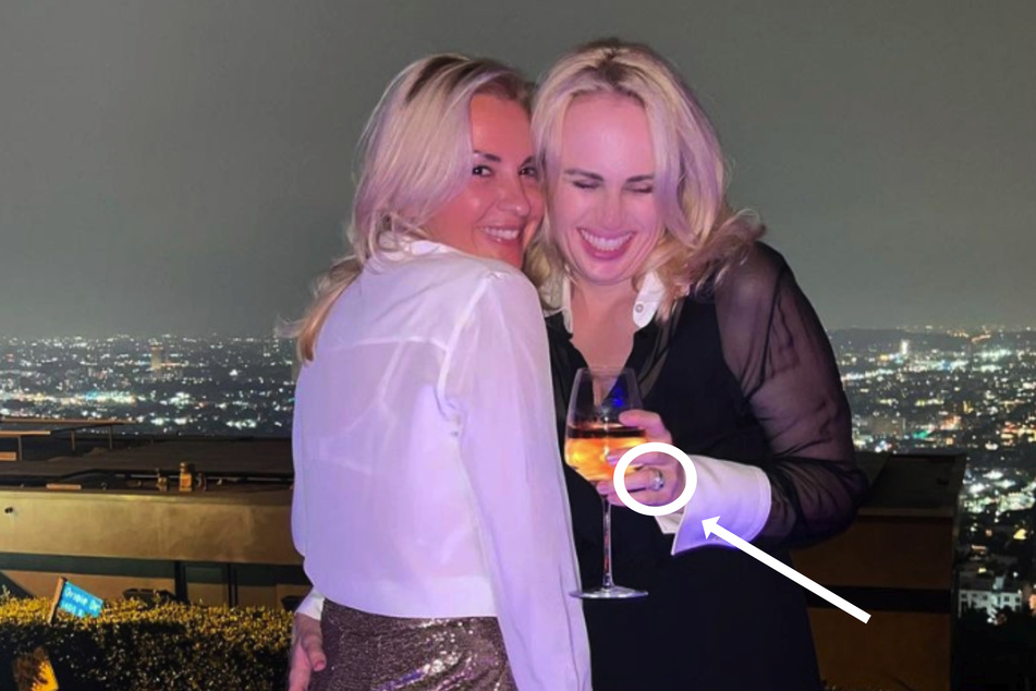 Could this bling on Rebel Wilson's (r) finger be an engagement ring?