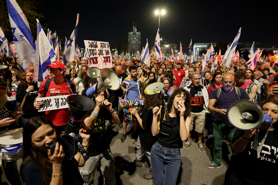 Israeli demonstrators shout slogans demanding the secure release of hostages held by Hamas in the Gaza Strip during a Jerusalem protest against the Israeli government on Sunday.