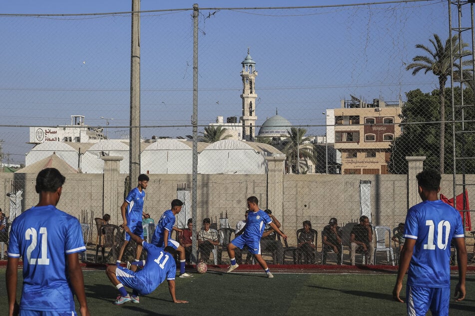 Shabab Rafah team players warm up ahead of their opening match against Khadamat Rafah during the 1,000 Martyrs Cup in Deir el-Balah, in the central Gaza Strip, on September 4, 2026.