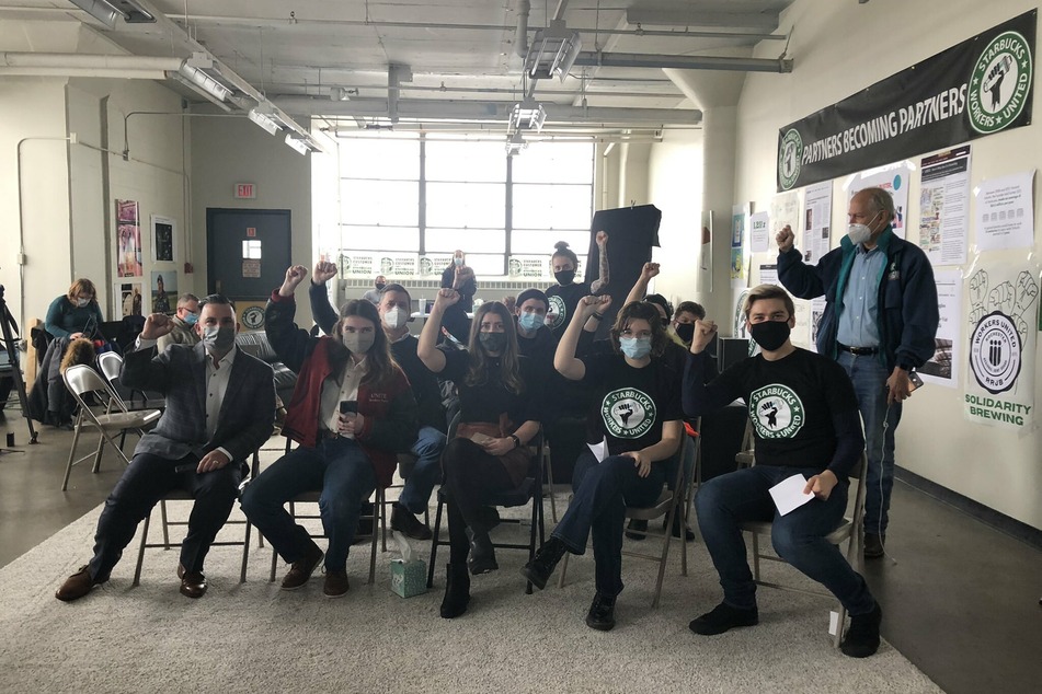 Starbucks Workers United organizers gather together to watch the counting of votes in their union election.