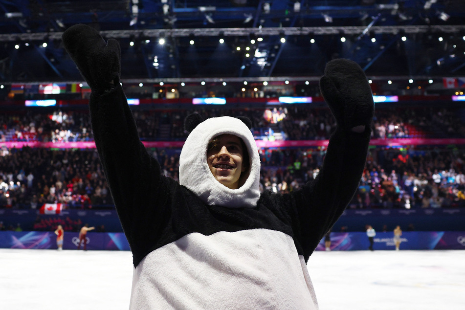 Mikhail Shaidorov of Kazakhstan performs in a panda suit during the Milan Cortina Olympics exhibition gala at the Milano Ice Skating Arena.