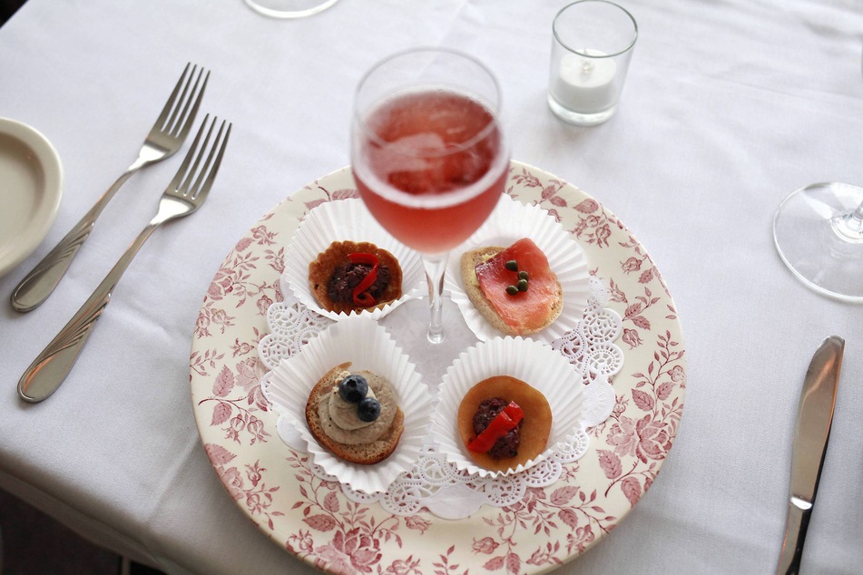 A Kir Royale served alongside appetizers.