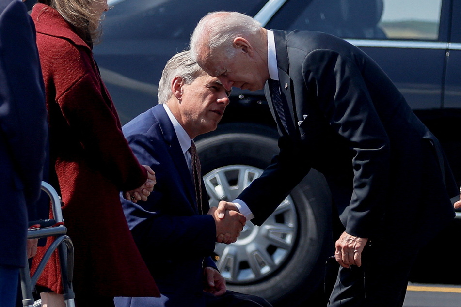 President Joe Biden shakes hands with Texas Gov. Greg Abbott en route to meet grieving families of the Robb Elementary School shooting.
