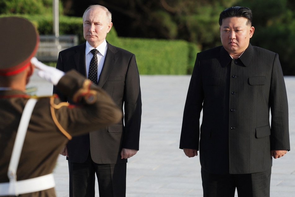 Russia's President Vladimir Putin (l.) has reportedly sent a letter to North Korean leader Kim Jong Un (r.) praising Pyongyang's soldiers fighting in Ukraine.