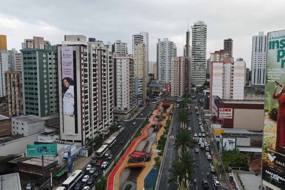 A drone view shows people passing by the Linear da Nova Doca Park, inaugurated by Brazil's President Luiz Inacio Lula da Silva who is overseeing the preparations for the COP30 climate summit, scheduled to be held in November in Belem.