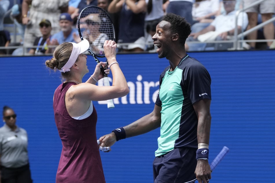 France's Gael Monfils (r.) and Ukraine's Elina Svitolina (l.) celebrate winning their US Open mixed doubles quarter final match against Britain's Henry Patten and Czech Republic's Katerina Siniakova (not pictured) on August 25, 2026.