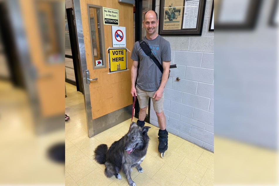 Toby Heaps and his dog Molly at the polls on Election Day.