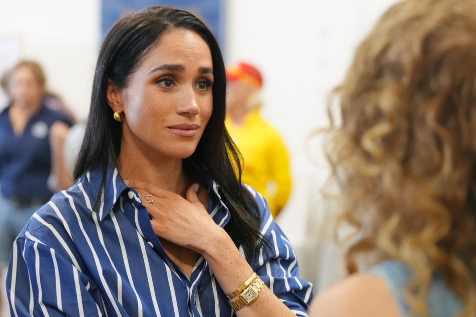 Meghan's new neighbor is reportedly concerned that the royal couple wants attention.
