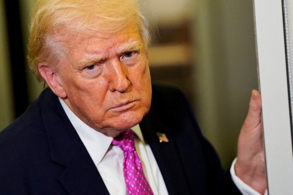 President Donald Trump speaks to members of the media aboard Air Force One en route to Joint Base Andrews, Maryland, on March 29, 2026.