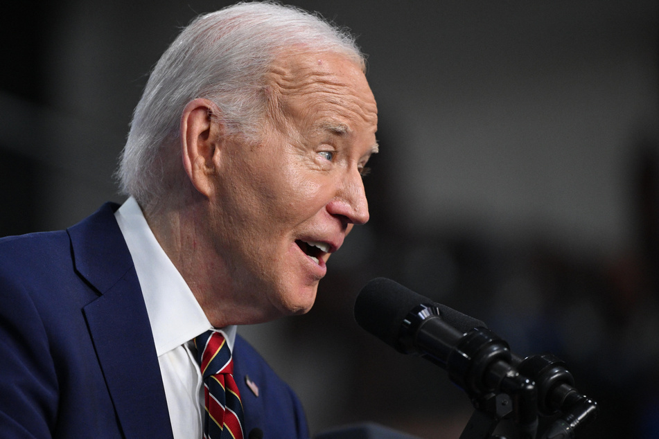 President Joe Biden (pictured) was seen reacting to Trump's controversial video in a clip shared on X.