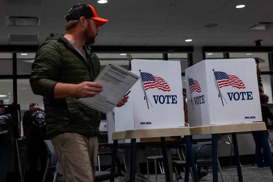 People vote at an election polling site on November 5, 2024, in Elkhorn, Wisconsin. Political strategists argue that Trump is already setting the stage to question the results of the midterm elections.