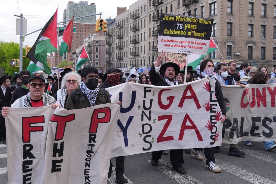 Pro-Palestinian demonstrators march from Columbia University to City College in April 2026.