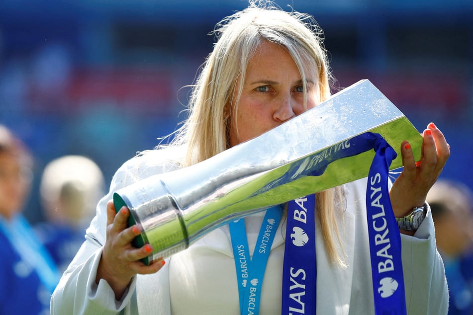 Chelsea manager Emma Hayes celebrates with the trophy after winning the Women's Super League Action.