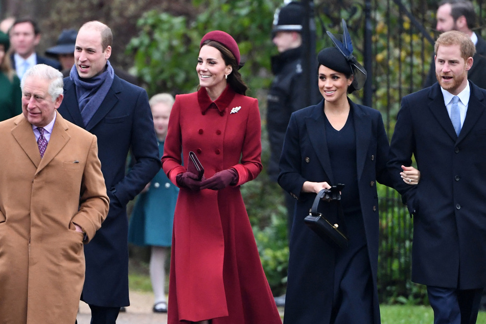 (From l. to r.) King Charles, Prince William, Princess Catherine, Duchess Meghan, and Prince Harry pictured in 2018.
